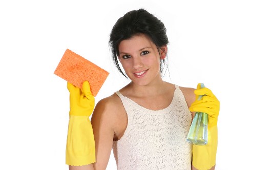 Local carpet cleaner treating stains and high-traffic areas in a Tooting property