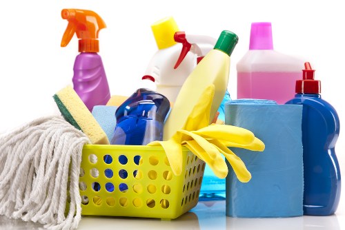 Cleaning staff applying chemical safety measures