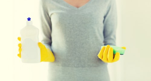 Deep cleaning a tiled floor in a Tooting kitchen